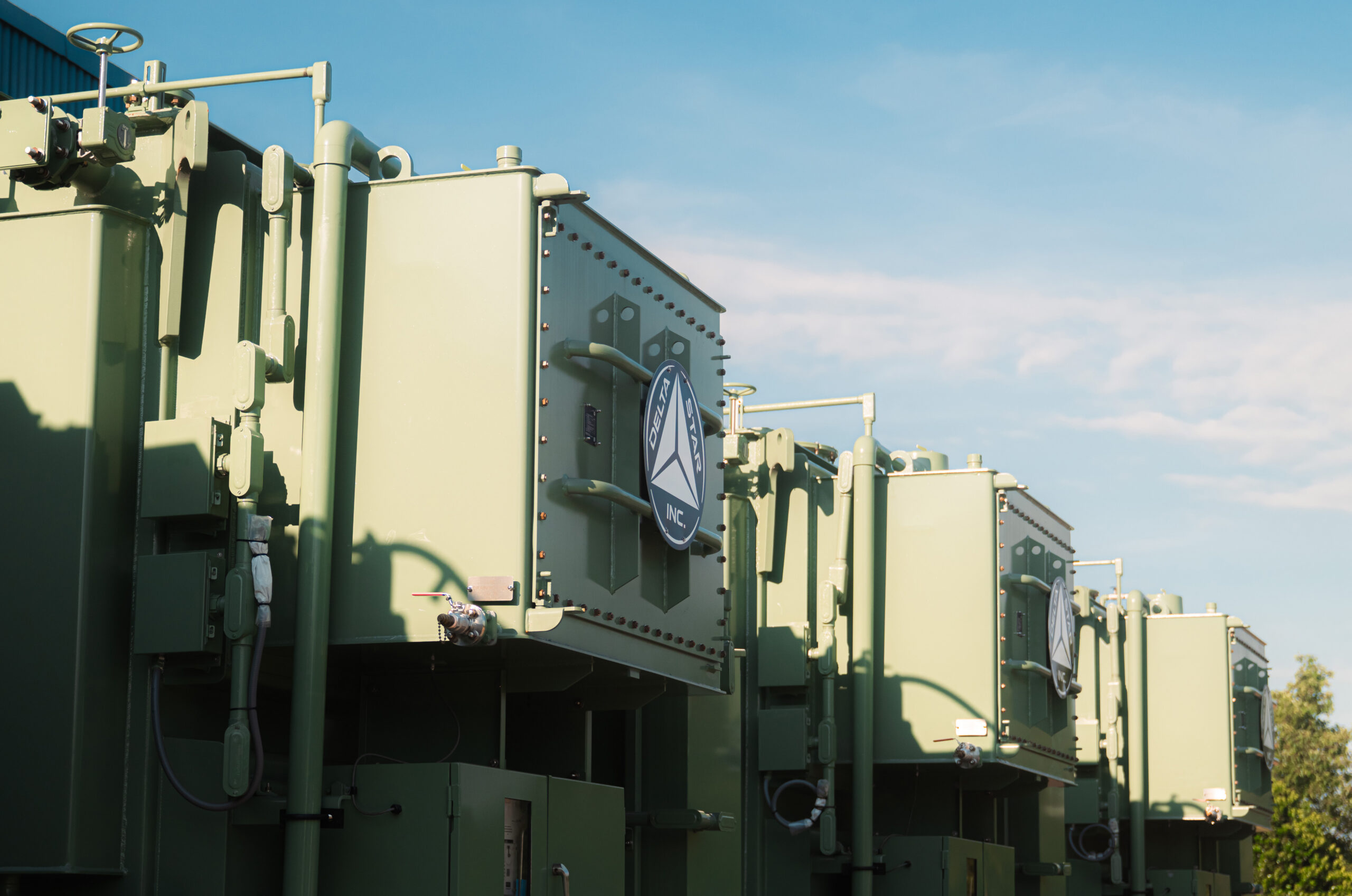 Delta Star logo displayed on the exterior of a power transformer manufacturing facility.